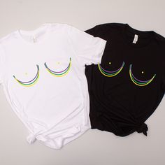 two t - shirts that have eyes drawn on them