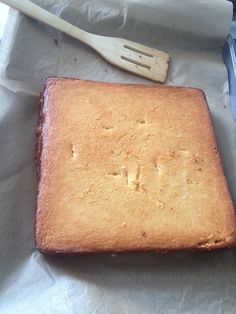 a cake sitting on top of a piece of paper next to a fork