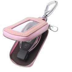 a pink cell phone case with a keychain hanging from it's side