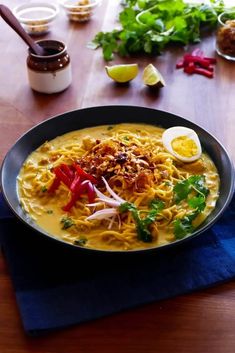 a bowl of soup on a wooden table