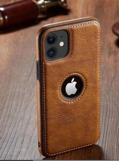 an iphone case sitting on top of a wooden table