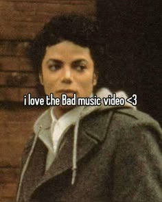 a man with the words i love the bad music video - 3 in front of him