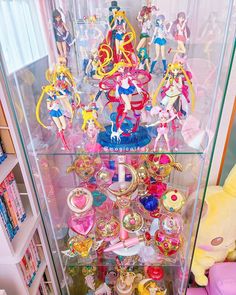 a display case filled with lots of sailor moon figurines and other anime toys