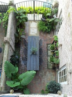 an overhead view of a patio with table and chairs surrounded by potted planters