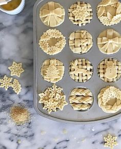 the cookies are ready to be baked in the muffin tins and decorated with snowflakes