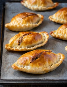 baked pastries on a baking sheet ready to be eaten