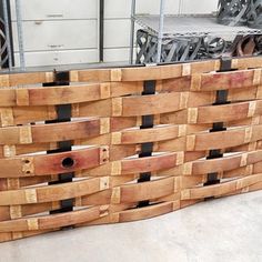 a large wooden basket sitting on top of a floor