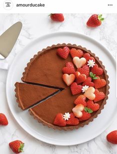 a chocolate cake with strawberries on top