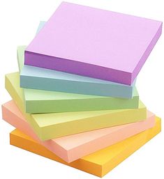 several different colored papers stacked on top of each other