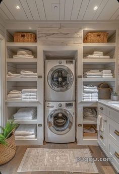 a washer and dryer in a room with lots of linens on the shelves