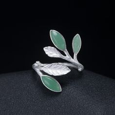 SPECIFICATIONS Size: Adjustable Shape\pattern: PLANT Ring Type: 925 Sterling Silver Finger Ring with Aventurine Jade Leaves Metal Stamp: 925, Material: 925 Sterling Silver Main Stone: Green Aventurine Item Weight: 3.5g Fine or Fashion: Fine Jade Rings For Women, Olive Leaf Ring, Plant Rings, Jade Rings, Green Stone Rings, Marquise Ring, Retro Ring, Sterling Silver Jewelry Handmade, Cuff Rings