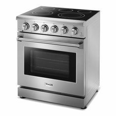 a stainless steel stove with four burners on the front and one oven door open