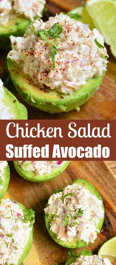 chicken salad stuffed avocado on a cutting board with limes and cilantro