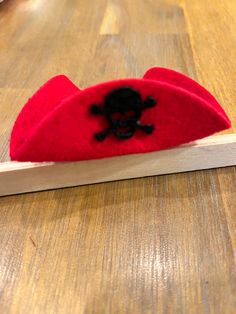 Small red pirate hat Pirate Costume Accessories For Halloween, Pirate Style Halloween Costume Accessories, Novelty Red Hat Costume Accessories, Red Novelty Hat Costume Accessories, Red Themed Cap Hat, Red Novelty Costume Hat, Themed Red Cap, Red Themed Halloween Hat, Red Themed Hat For Costume Party