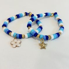 Handmade Clay Bead Bracelet Three Tone Blue W/ White And Gold. Flower Or Starfish Charm, Message Me About Which One You Prefer! Blue Bracelets Clay Beads, Wax Cord Bracelet With Beads, Steelers Clay Bead Bracelet, Bracelets With Flat Beads, Matching Clay Bead Bracelet, Clay Bead Bracelet Ideas Patterns, Polymer Bead Bracelets Ideas, Cute Bracelet Inspo Clay Beads, Blue Beaded Heishi Friendship Bracelets