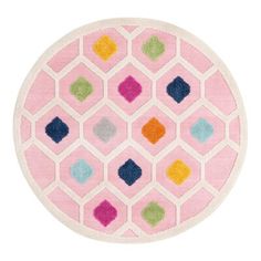 a pink rug with multicolored squares on the top and bottom in different colors