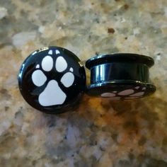 Bundle This Listing With Two Other *3/$20* Listings And I Will Send Private Offer Plus Shipping Discount! Pair (2) Black Acrylic Plugs With A Black And Gray Paw Design. Screw Fit For Ease Of Insertion Use In Healed Piercings Only. Not For Initial Piercings. Sizes: 12mm - 1/2 If You Have Any Questions At All Please Don't Hesitate To Ask. If You Have Had A Reaction To A Material In The Past, We Do Not Recommend Ordering Or Wearing Any Jewelry Made With That Material As It Could Cause A Reaction. A Ear Art, Virtual Girl, Paw Design, Gauges Plugs, Funky Jewelry