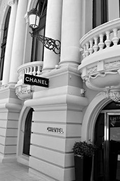 a black and white photo of a chanel store