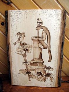 a drawing of a water faucet with flowers and birds on it, in front of a wood panel