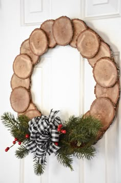 a christmas wreath hanging on the front door