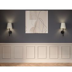 two lamps on the wall next to a painting in a room with white paneling