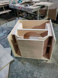 the unfinished cabinet is ready to be built in the shop, and it's being worked on