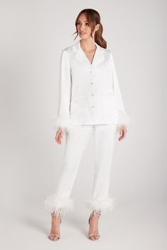 DESCRIPTION & FEATURES Meet DARCIE. Our MERABI Pajamas are now in White. Perfect for the bride herself or a gift for loved ones. Made from our exclusive, beautifully designed silk touch fabric, these little beauties will make you feel amazing. These premium pyjamas are perfect for the complete bridal party to enjoy! Here at NADINE MERABI we have spent time making these fit perfectly and feel wonderful when worn. With a feather trim to the cuff, White satin binding on the shirt and trouser hem cu White Pyjamas, Nadine Merabi, Pijamas Women, Luxury Pajamas, Red Pajamas, Black Pajamas, Pyjama Satin, White Pajamas, Best Pajamas