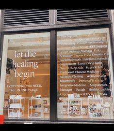 the front window of a building that says let the healing begin