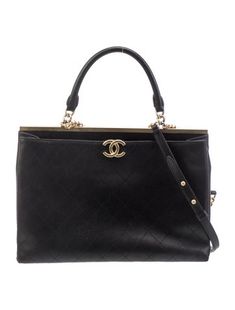 Chanel ToteFrom the Spring/Summer 2018 Collection by Karl LagerfeldBlack CalfskinInterlocking CC Logo, Quilted Pattern & Chain-Link AccentGold-Tone HardwareRolled Handles & Chain-Link Shoulder StrapLeather Lining & Four Interior PocketsSnap Closure at TopIncludes Box & Dust Bag Handbag Handles, Quilted Pattern, Cc Logo, Shopping Tote, Chain Link, Quilt Patterns, Coco, Dust Bag, Women Handbags