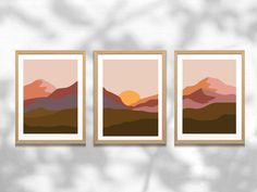 three framed art prints with mountains in the background