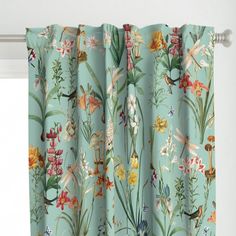 a curtain with flowers and plants on it