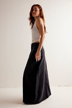 Forever cool and classic denim maxi from our We The Free collection. **Fit:** Mid-rise, A-line silhouette and rigid denim **Features:** Zip fly and button closure, four-pocket design, inverted yoke seam at front, raw-edge hem **Why We | We The Free Come As You Are Denim Maxi Skirt at Free People in Black, Size: US 0 Black Denim Maxi Skirt, Maxi Skirt Style, Free People Maxi, Black Denim Skirt, Denim Maxi, Free People Skirt, Denim Maxi Skirt, Dark Indigo, Madewell Denim