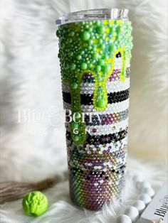 a cup that has some beads on it