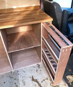 the inside of a van with shelves and drawers