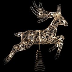 a lighted christmas reindeer on top of a spiral wire pole with lights in the shape of an antelope