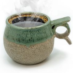 a cup with steam rising out of it