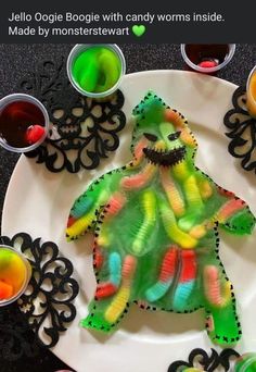 a paper plate that has some food on it and is decorated with gummy bears