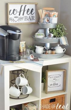 a coffee bar with three tiered shelves filled with cups and mugs on it