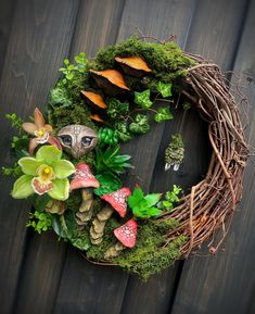 a wreath made out of plants and mushrooms