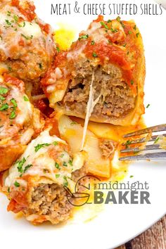 meat and cheese stuffed shells on a white plate