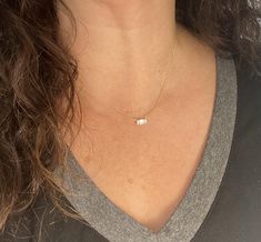 This beautiful and dainty baguette necklace is available in thick and durable rhodium plated .925 sterling silver or 14K gold plated .925 sterling silver. The CZ stone is approximately 4x6mm. The natural ashes will be set behind the stone so the stone color may vary depending on the ash color showing through. Mailing instructions for your ashes can be found on the main page of the website. Please mail them to me ASAP. You can order a prepaid shipping kit if you would like, but it is not required Dainty White Jewelry With Baguette Diamonds, Dainty White Baguette Diamond Jewelry, Delicate Everyday Jewelry With Baguette Diamonds, Delicate Baguette Diamond Necklace Gift, Delicate Baguette Diamond Jewelry Gift, Delicate Baguette Diamond Jewelry For Everyday, Minimalist Baguette Diamond Jewelry As Gift, Dainty Sterling Silver Jewelry With Baguette Diamonds, Baguette Diamond Necklace As A Gift