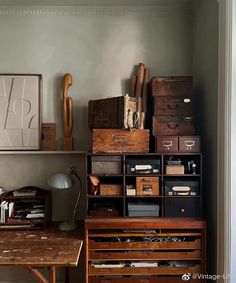 an old desk with lots of drawers and boxes on it