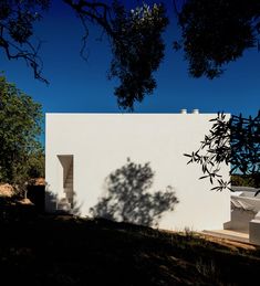 a white house sitting on top of a hill