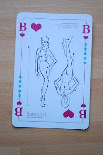 a playing card with an image of a woman in the shape of a man on it