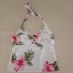 Leilani Floral Swim Top. Women's Size 12. Brand New With Tags. Top Has A Few Spots From The Sales Floor. See Pictures. Features Removable Breast Pads And Atraps That Tie For A More Secure Fit. The Right Best Pad Has A Fold Line In It From Being Folded. Colors Are White, Green, And Different Shades Of Pink. Comes From A Smoke Free Home. We Have A Cat Friendly Home. Use My Code Tbkersey To Save $10 On Your Purchase Of $10 Or More When You Sign Up For Poshmark And Make Your First Purchase. Summer Stuff, Different Shades Of Pink, Fits Clothes, Coconut Girl, Cute Bathing Suits, Floral Swimsuit, Swim Suits, Cat Friendly, Shades Of Pink