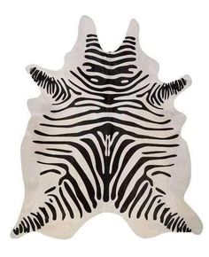 a black and white zebra print rug on a white background with an animal's head