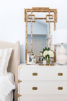 an instagram page with a white dresser and gold accents