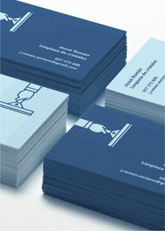 several business cards stacked on top of each other