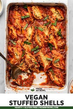 vegan stuffed shells in a white casserole dish