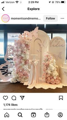 a white and pink wedding cake with flowers on it